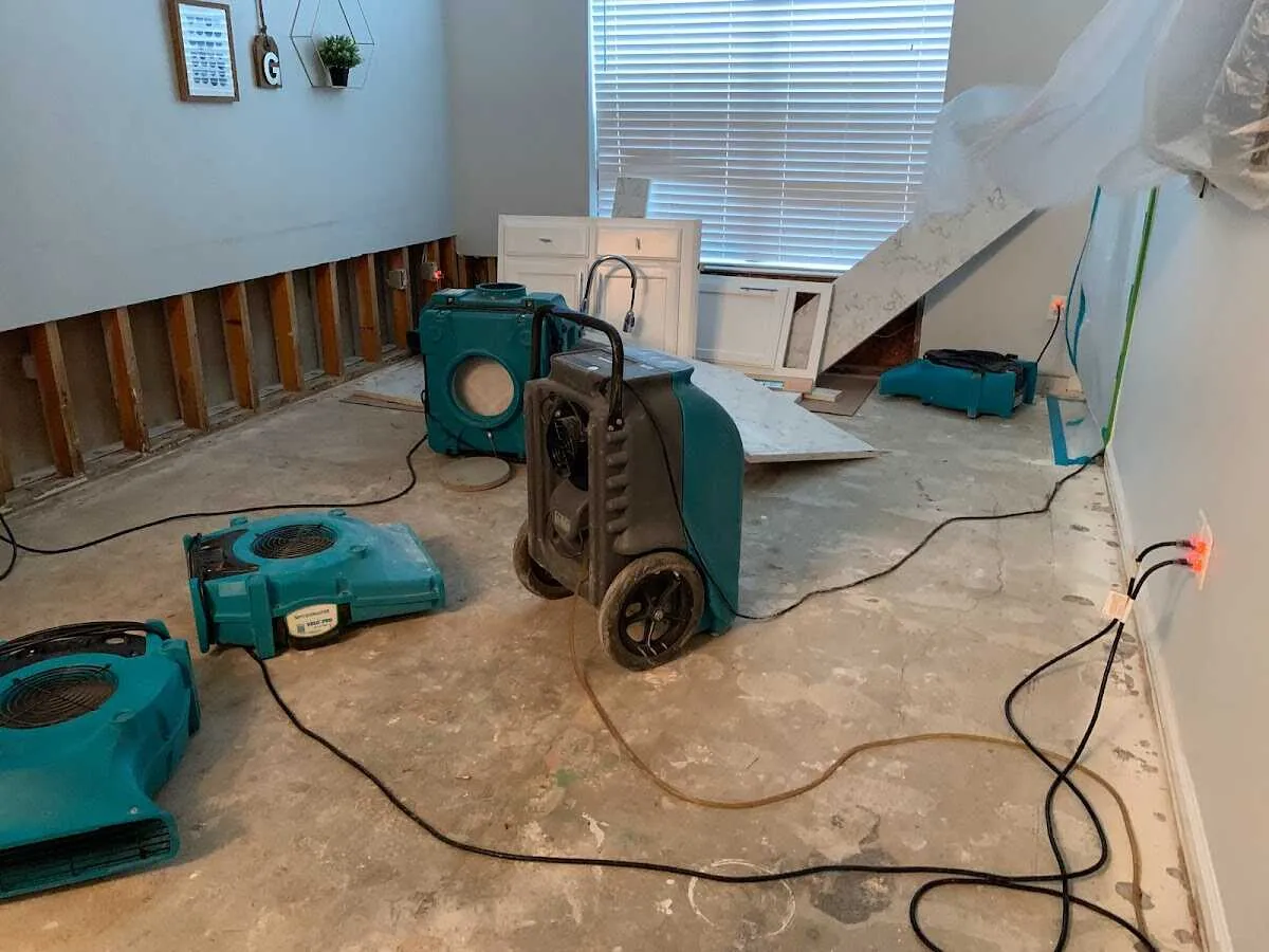 Dehumidifier in flood-cut room for Water Damage Restoration in Cecil